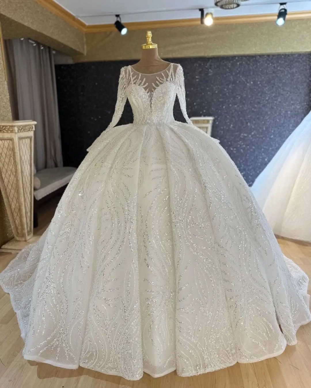 Long-sleeved sequinned ball gown in the atelier