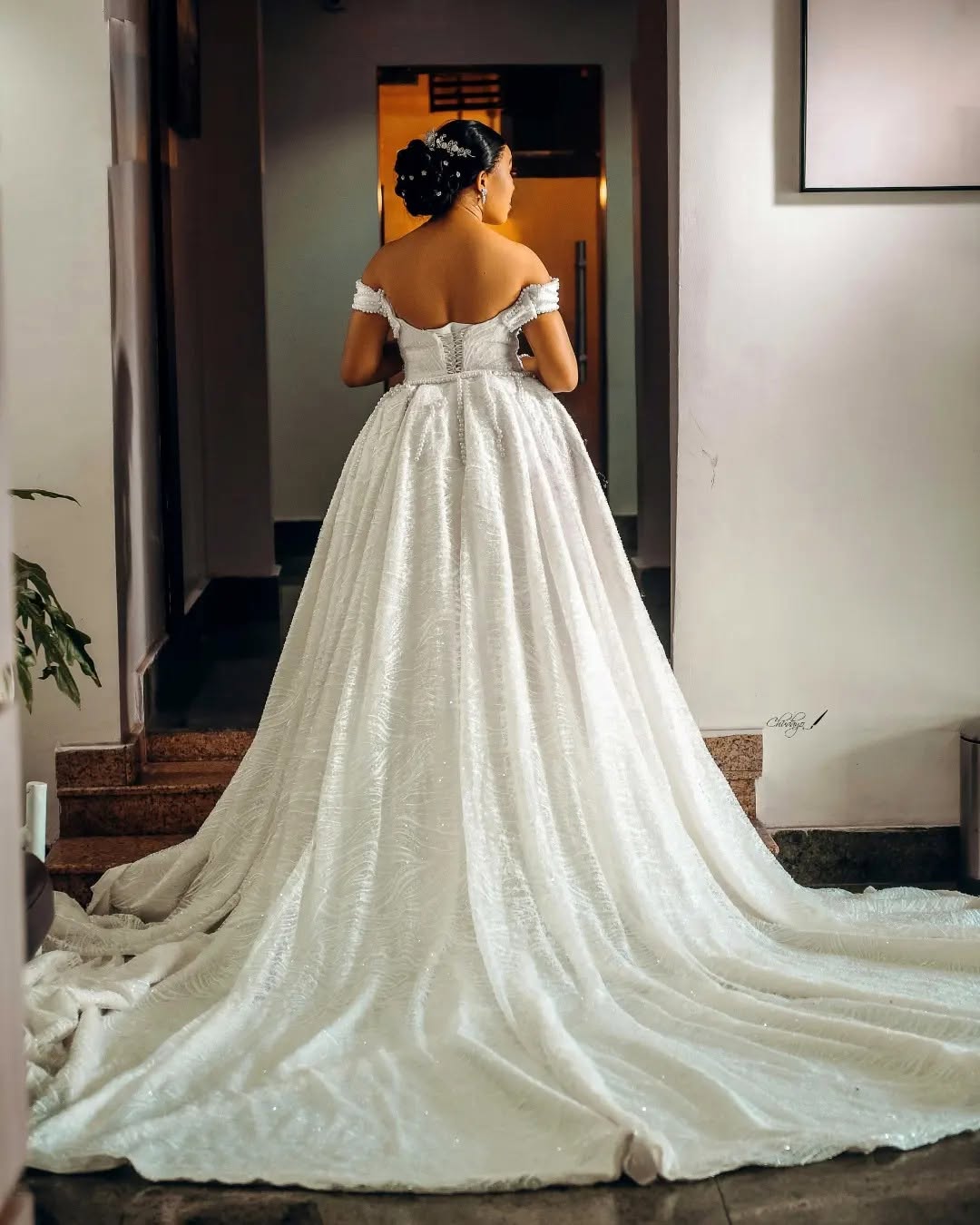 Back view of a beaded gown with a cathedral train
