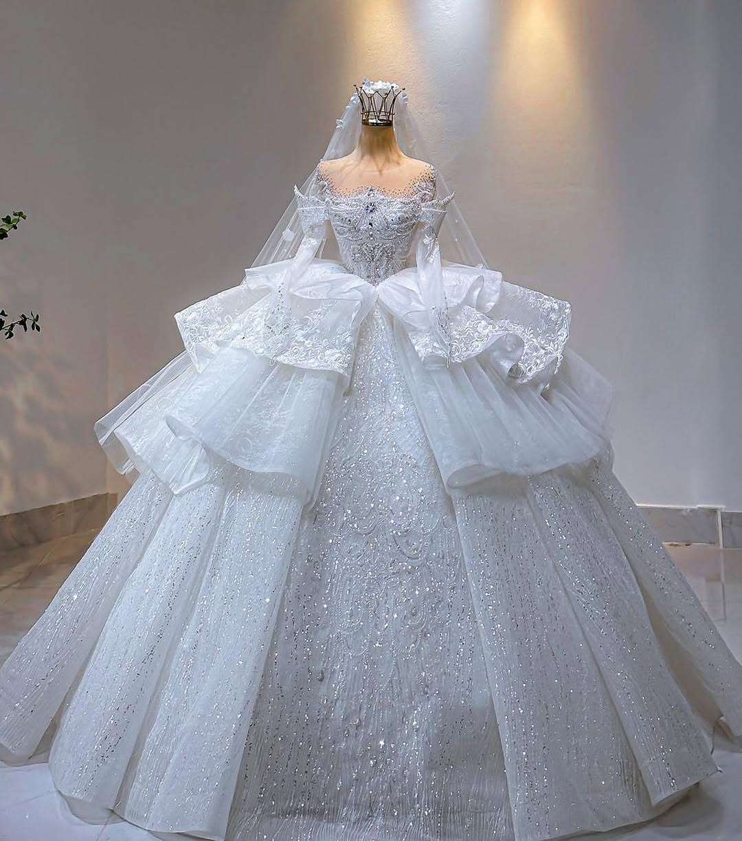 Tiered sparkling ball gown on display in the boutique